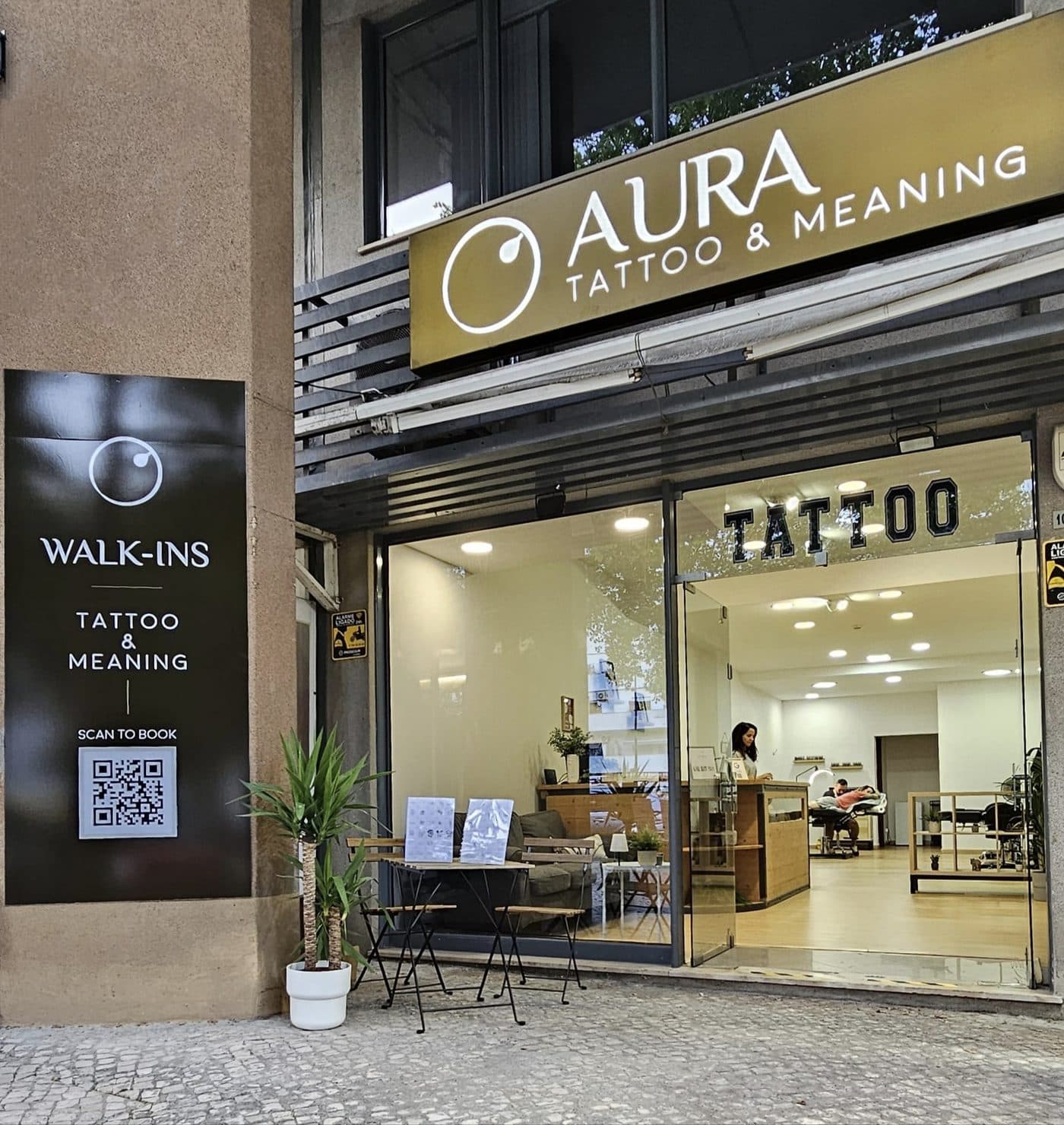 Aura storefront at night